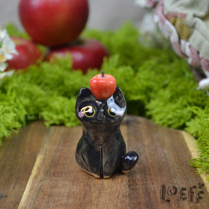 Tiny Black Cat with Apple