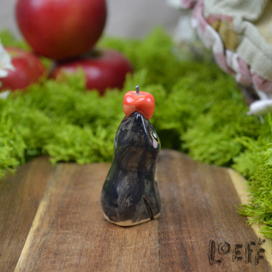 Tiny Black Cat with Apple