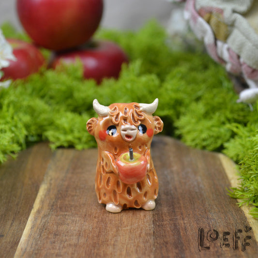 Tiny Highland Cow with Apple