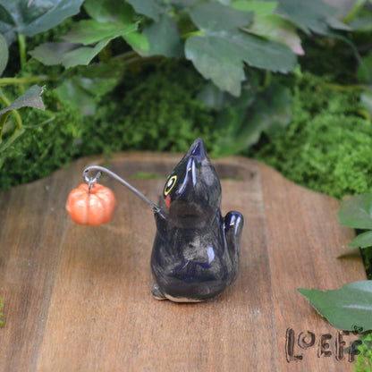 Tiny Black Cat with Jack o' Lantern