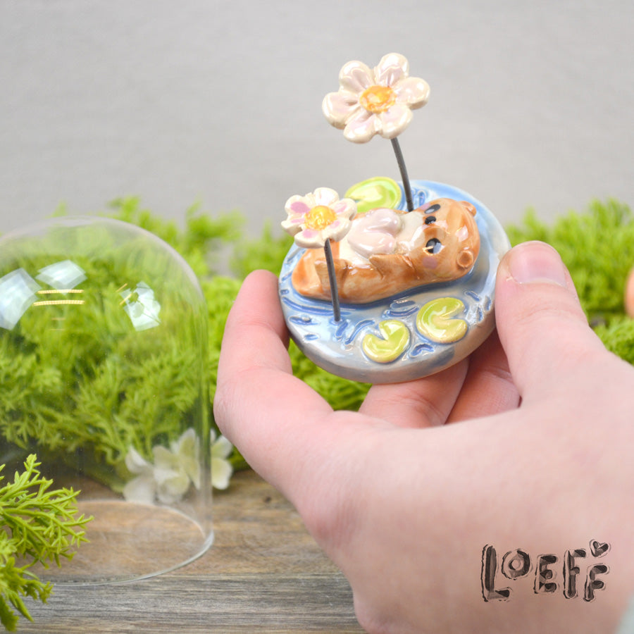Showstopper Loeff Small Dome Otter Swimming Between Flowers